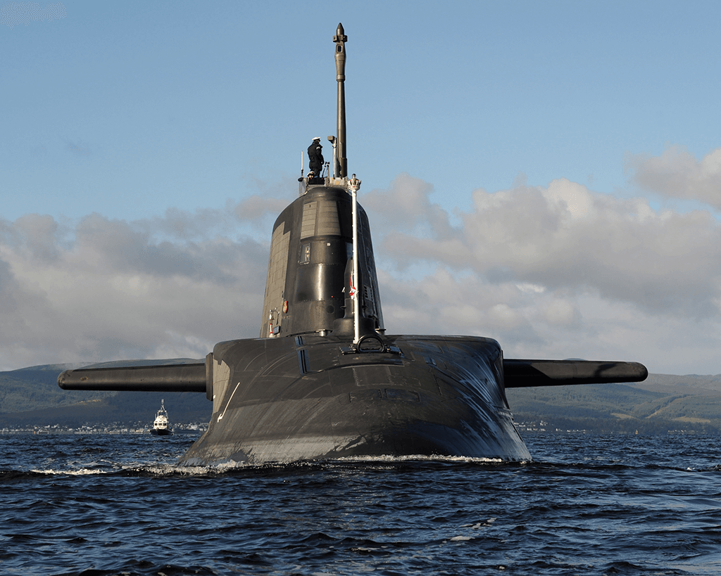 Submarine travels on surface with crew visible on sail. - CROWN COPYRIGHT 2012 LA (Photo) Stu Hill
